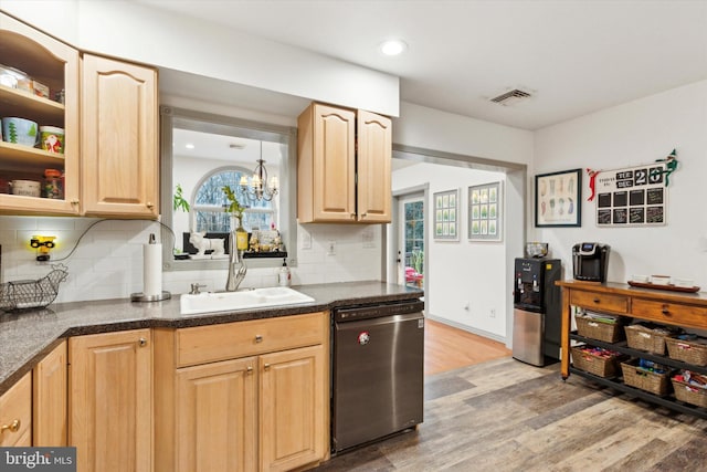 kitchen with dishwashing machine, backsplash, light brown cabinets, and hardwood / wood-style floors