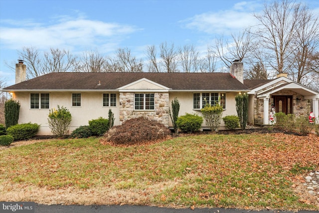 ranch-style house with a front yard