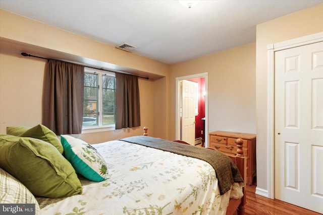 bedroom with hardwood / wood-style floors