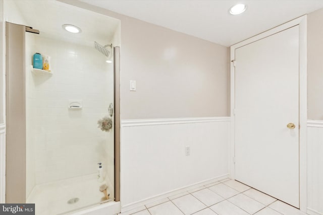 bathroom with tile patterned floors and an enclosed shower