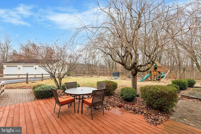 wooden terrace featuring a playground