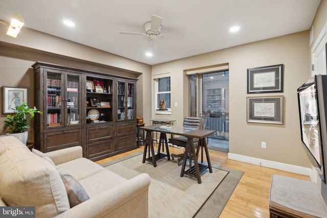 office featuring ceiling fan and light wood-type flooring