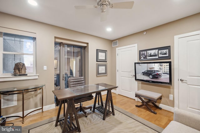 home office featuring ceiling fan and hardwood / wood-style floors