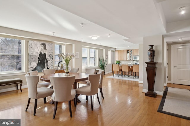 dining area featuring light wood-type flooring