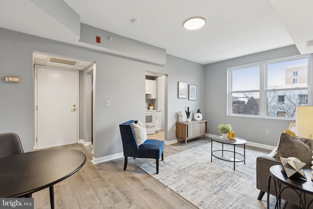 living area featuring light hardwood / wood-style floors