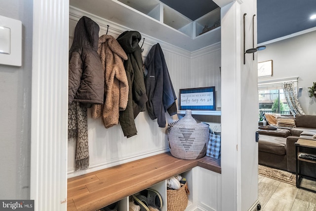 mudroom featuring crown molding