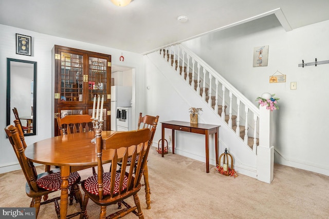 view of carpeted dining space