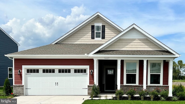 craftsman-style house with a garage and a porch