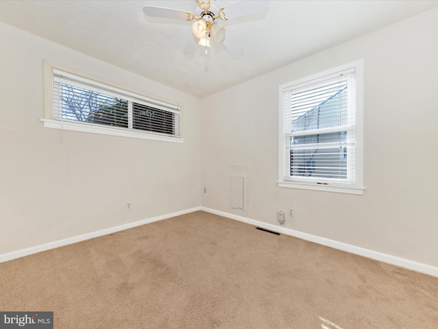 carpeted empty room with ceiling fan