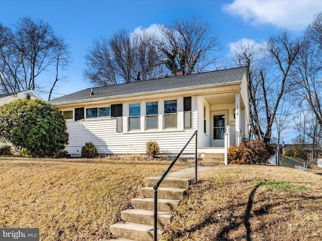 view of front of property with a front lawn