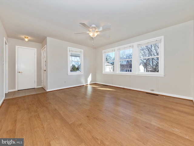 unfurnished room featuring ceiling fan and light hardwood / wood-style floors