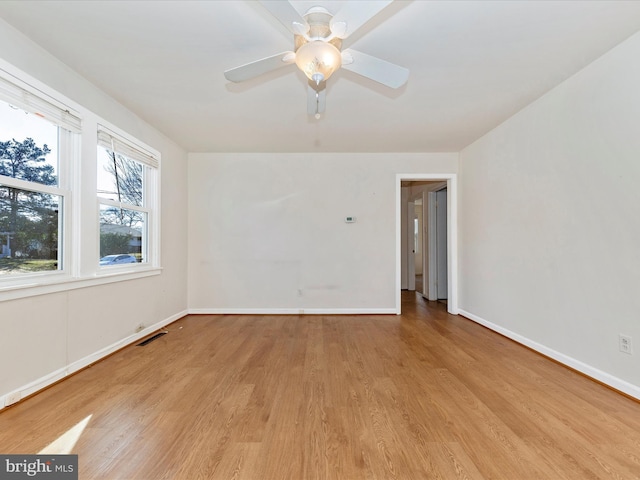 unfurnished room featuring ceiling fan and light hardwood / wood-style flooring