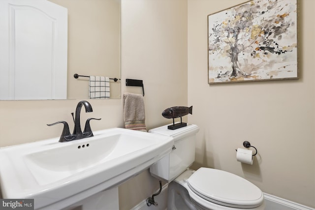 bathroom featuring a sink and toilet