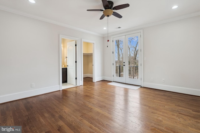 unfurnished bedroom featuring access to exterior, ornamental molding, wood finished floors, and french doors