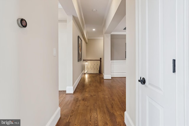 hallway with baseboards, dark wood finished floors, crown molding, an upstairs landing, and recessed lighting