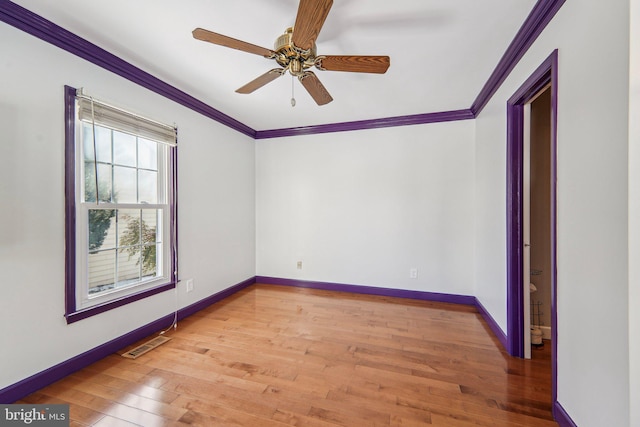 unfurnished room with ornamental molding, ceiling fan, and light hardwood / wood-style flooring