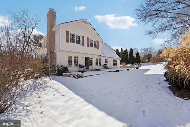 view of snow covered property