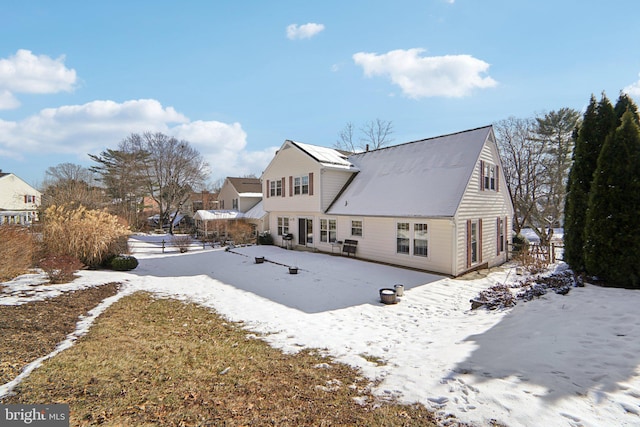 view of snow covered house