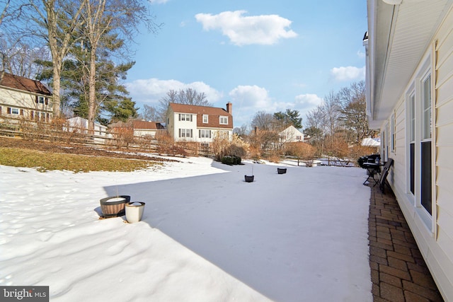 view of yard covered in snow