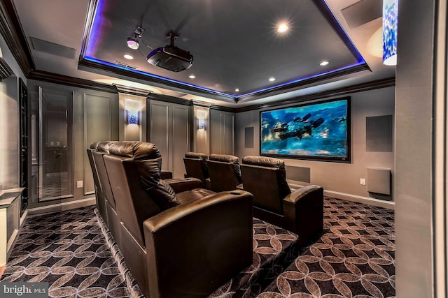 cinema featuring crown molding and a raised ceiling