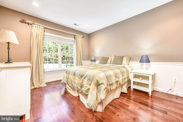 bedroom with hardwood / wood-style floors