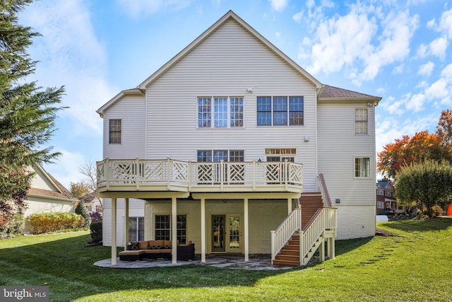 back of property with a wooden deck, a yard, and outdoor lounge area