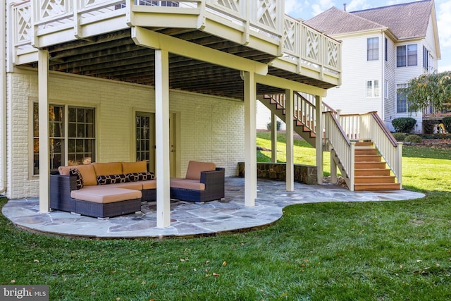 rear view of property with a yard, an outdoor hangout area, and a patio