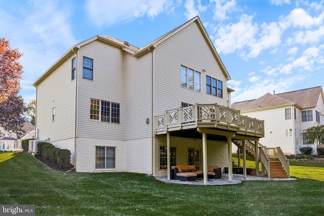 back of house with a patio, a deck, an outdoor hangout area, and a yard