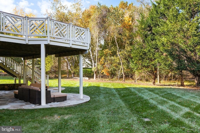 view of yard with a patio, outdoor lounge area, and a deck