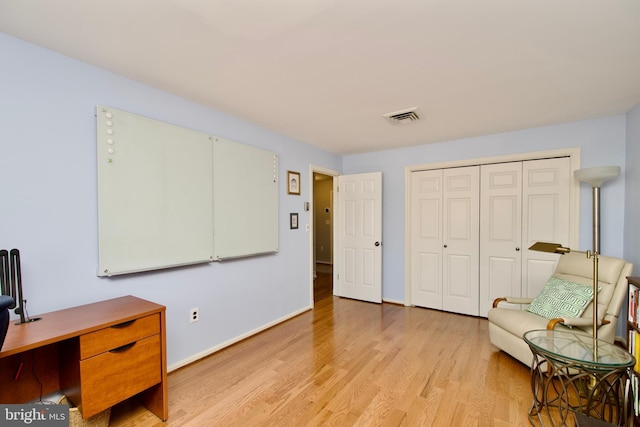 sitting room featuring light hardwood / wood-style floors