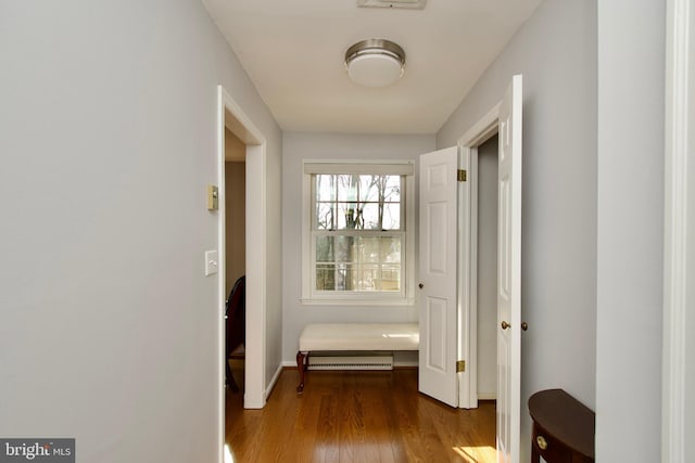 corridor featuring hardwood / wood-style floors