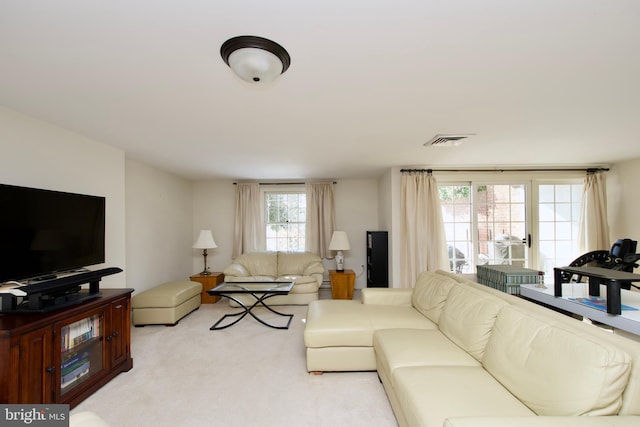 living room featuring light carpet