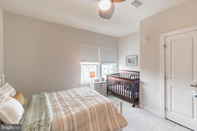 bedroom featuring ceiling fan and light colored carpet