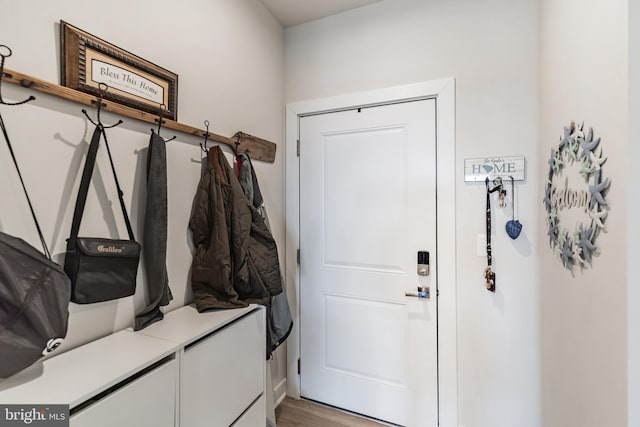 mudroom with light hardwood / wood-style floors