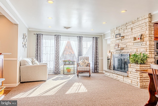 unfurnished living room with carpet, ornamental molding, and a stone fireplace