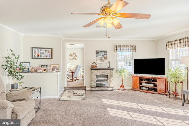 living room with a fireplace, light colored carpet, ceiling fan, and ornamental molding