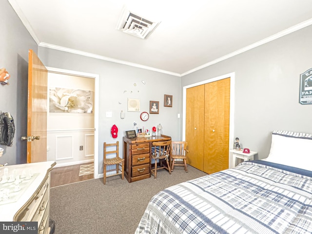 carpeted bedroom featuring a closet and crown molding