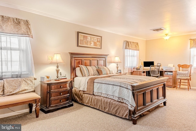 bedroom with carpet and crown molding