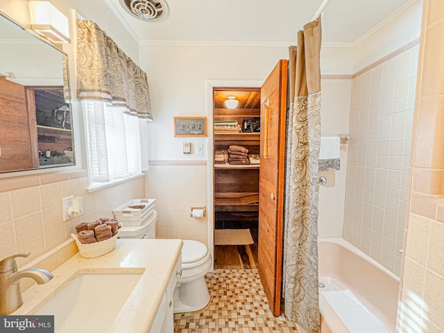 full bathroom featuring toilet, crown molding, tile walls, shower / bath combination with curtain, and vanity