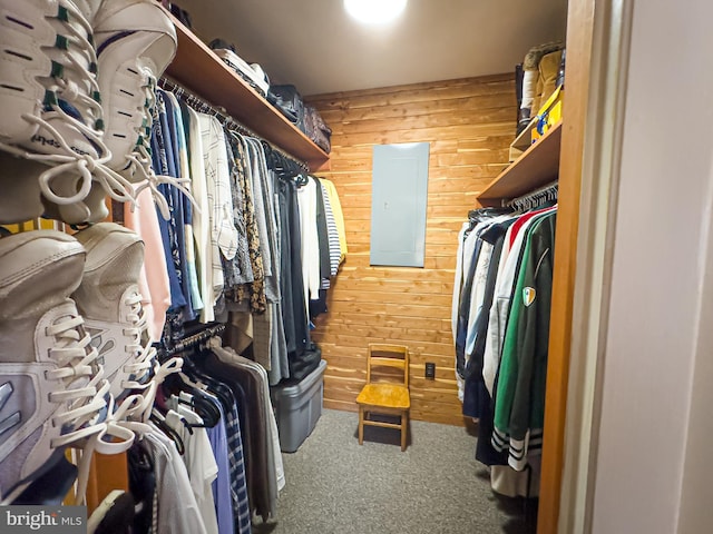 walk in closet featuring carpet