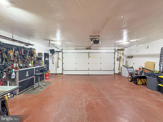 garage featuring a workshop area and a garage door opener