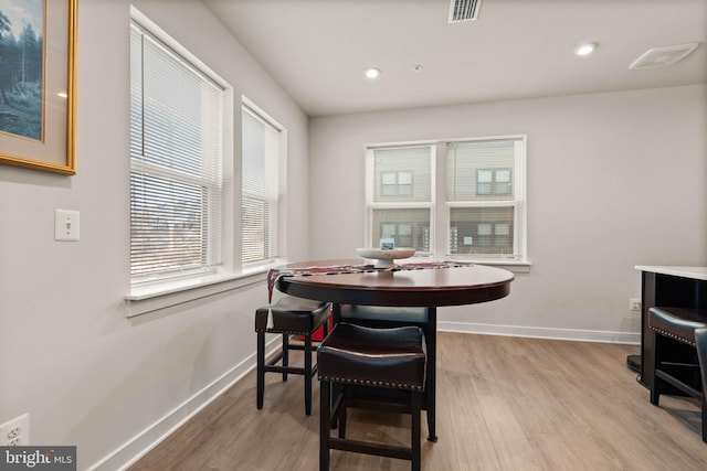 dining area featuring hardwood / wood-style flooring