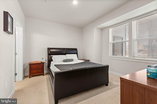 bedroom with light colored carpet