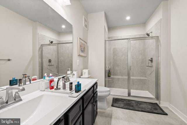 bathroom with walk in shower, vanity, and toilet