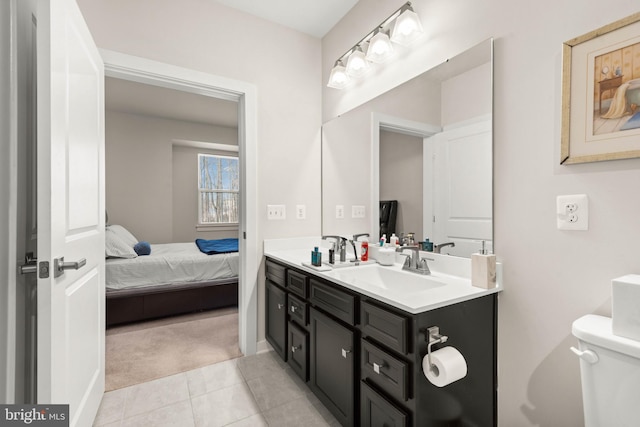 bathroom with vanity, tile patterned floors, and toilet