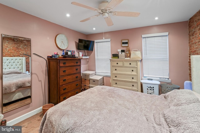 bedroom featuring ceiling fan and light hardwood / wood-style flooring