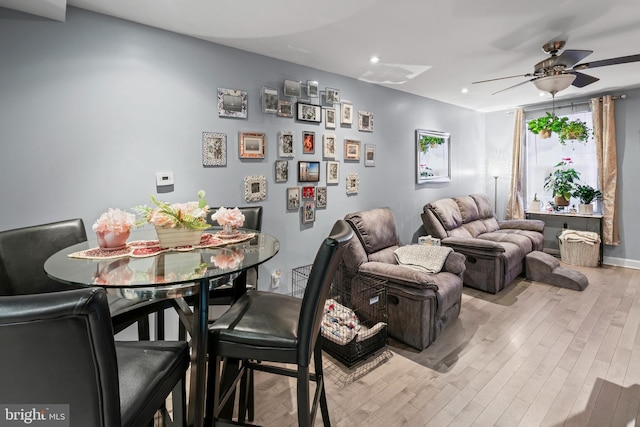 interior space with ceiling fan and light hardwood / wood-style flooring