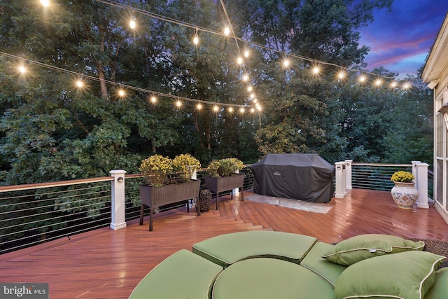 deck at dusk with a grill