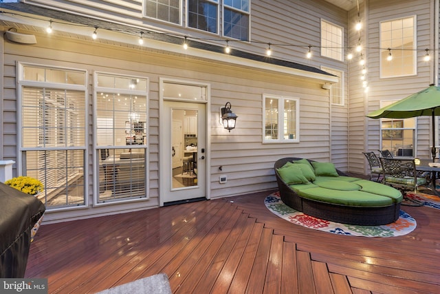 wooden terrace with a grill