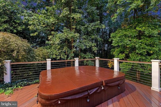 wooden deck featuring a covered hot tub